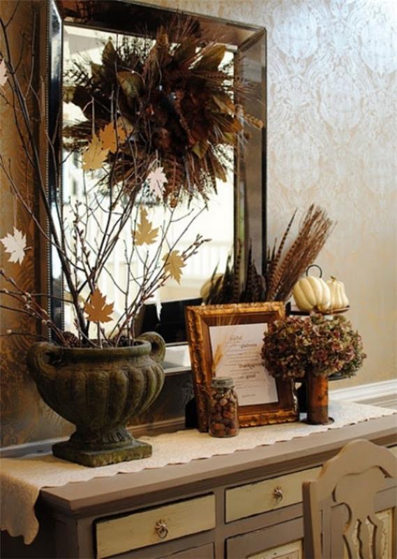 Adorables idées de décoration d'automne dans un style vintage sur la console devant le miroir, gerbe colorée de feuilles de blé