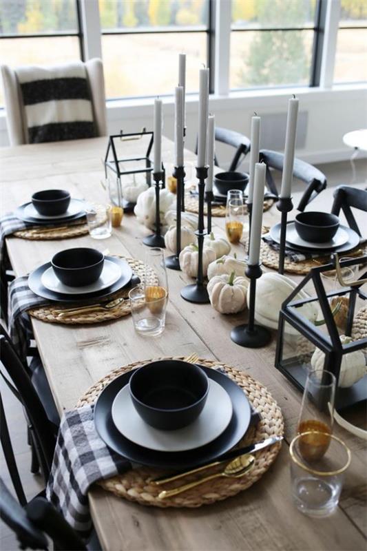 Table en bois citrouilles blanches bougeoir noir contraste