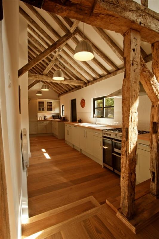 Conceptions de cuisine table à manger de style campagnard chaises poutres en bois parquet