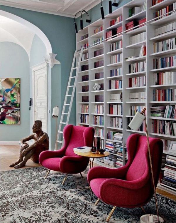 Fauteuil design chic bibliothèque maison moderne en tête de sculpture bordeaux