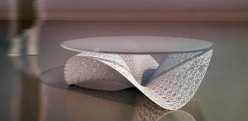 niezwykła konstrukcja stołu owalny szklany blat