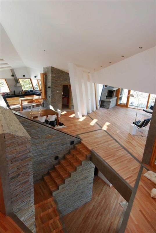 niezwykłe domy wakacyjne dom wstążkowy nowoczesna architektura drewniana podłoga okładzina ścienna z kamienia naturalnego