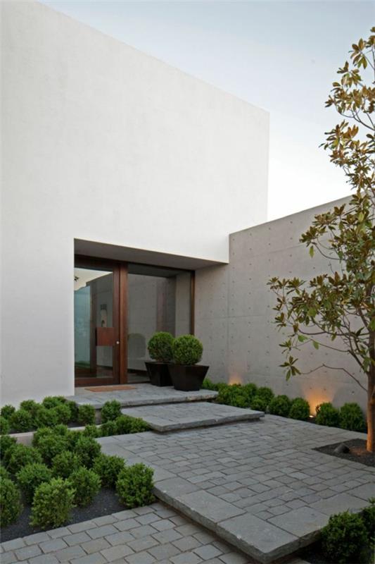 przykłady nowoczesnego projektowania ogrodów z kostki kamiennej schodkowej