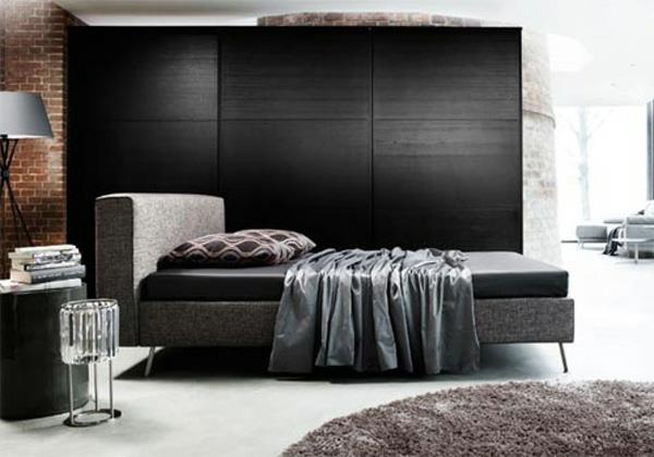 brązowy mur z cegły czarne ściany pomysł na projekt sypialni