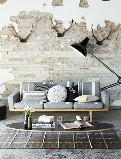 cool grunge designs d'intérieur canapé gris coussins différentes formes table ovale
