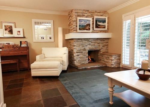 salon cosy cheminée encastrable pierre transat ergonomique cuir blanc