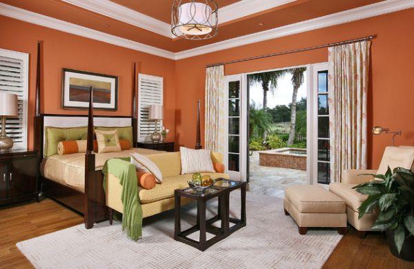 fajna kolorystyka sypialni akcentuje pomarańczowe ściany