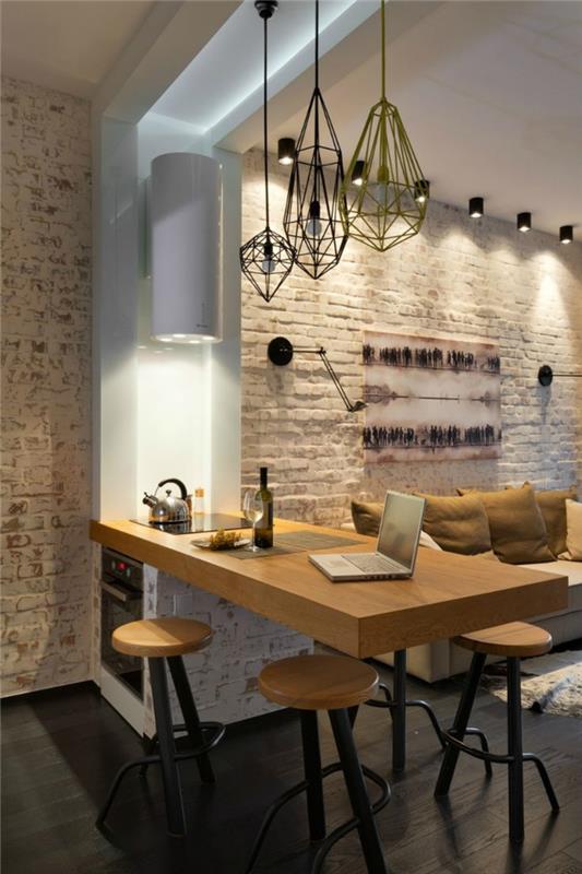 pomysły na umeblowanie porady dotyczące wyposażenia kuchni stołek barowy licznik wyspa kuchenna nowoczesny salon otwarty plan loft mieszkanie mur z cegły