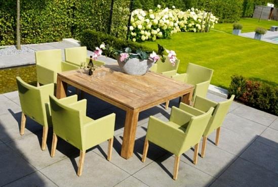 bajeczny projekt jadalni w ogrodzie drewniane tapicerowane krzesła zielone