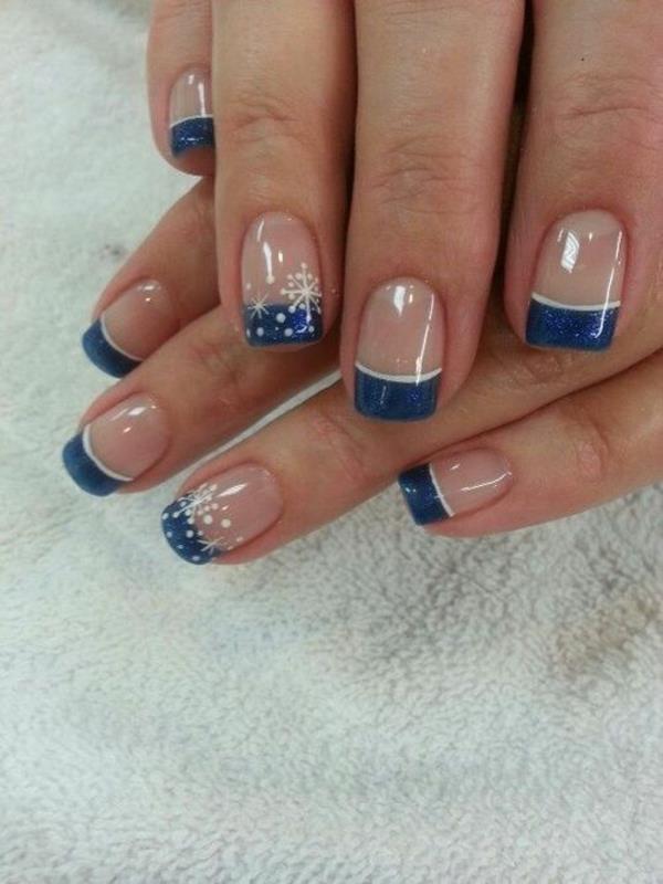 ongles en gel motif ongles français bleu foncé cristaux de neige blancs