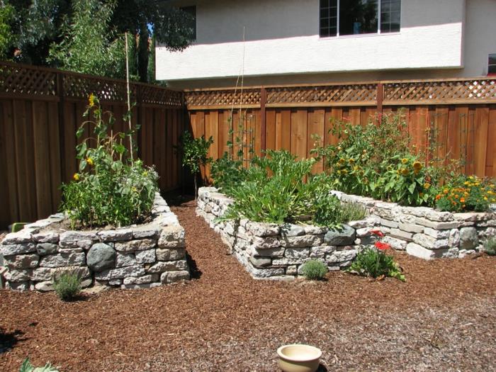 lits surélevés pierre design jardin plantes jardin clôture