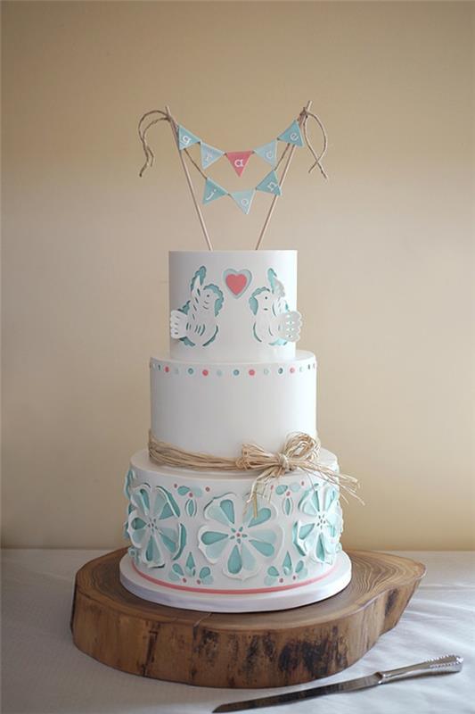 gâteaux de mariage motif 3d fleurs colombes dentelle optique palstellblau glaçure blanche