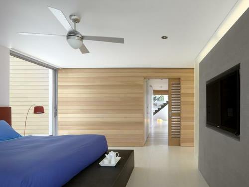 revêtement mural en bois véritable idée de design en bois chambre à coucher couvre-lit bleu