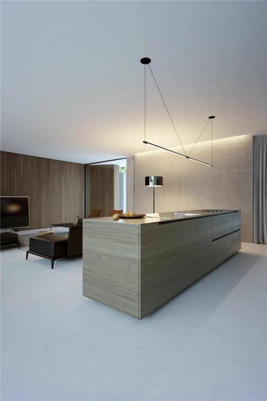 oświetlenie pośrednie sufit otwarty salon kuchnia wyspa ściana betonowa