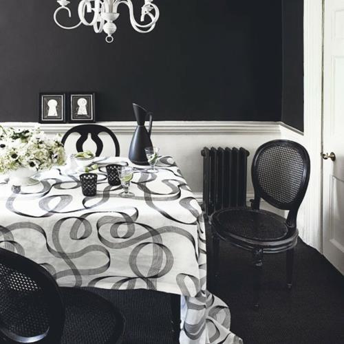 décoration d'intérieur en noir et blanc nappe fleurs chaises radiateurs