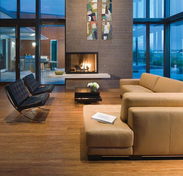 Cheminées vitrées appartement moderne canapé d'angle en cuir fauteuil