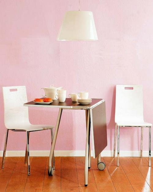 Table pliante dans le coin cuisine idée de matériau métallique mur rose