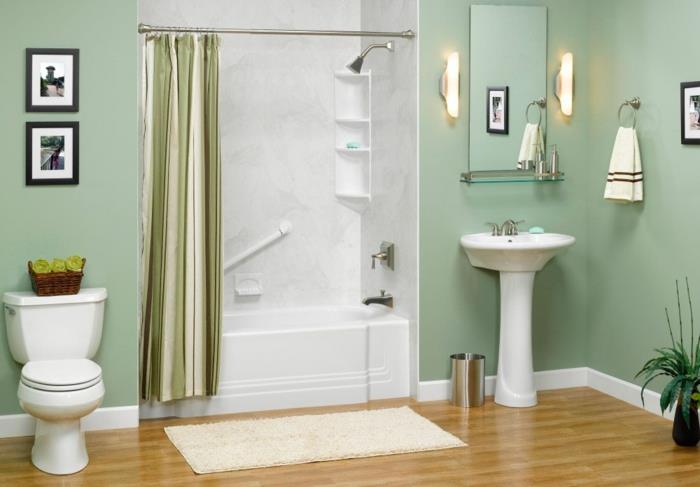 Mała łazienka z wbudowaną wanną prostokątna zielona pastelowa farba ścienna