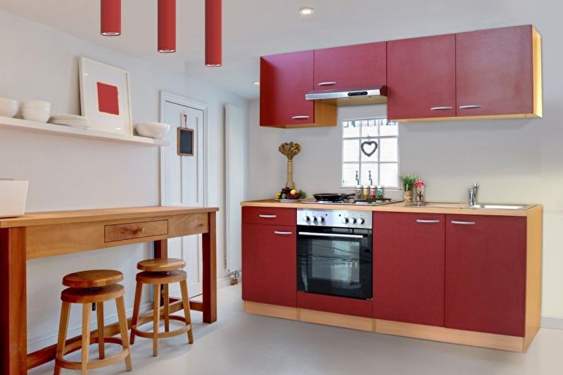 التصميم الداخلي للمطبخ باللون الأحمر - الصورة