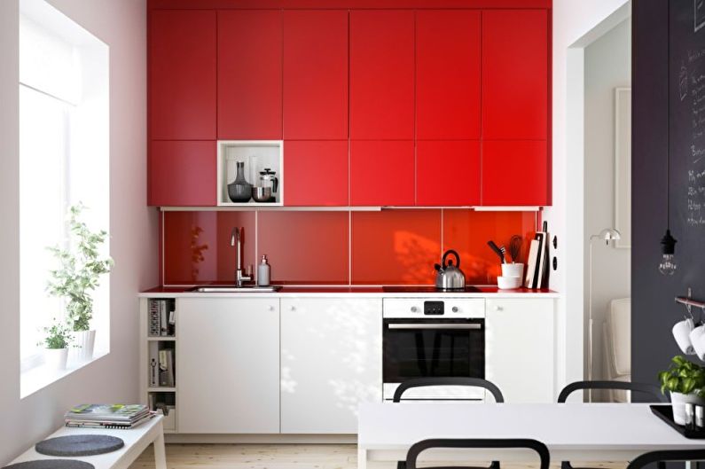التصميم الداخلي للمطبخ باللون الأحمر - الصورة