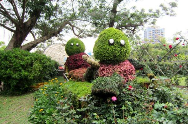personnages de dessins animés paysage jardin sculptures buissons