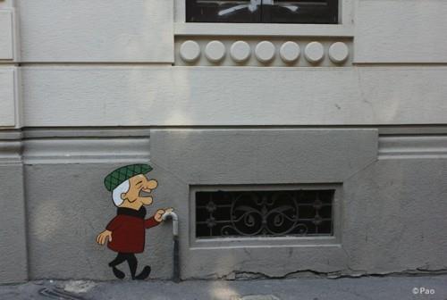 homme avec une idée d'art de rue de bâton