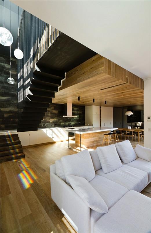 nowoczesne wnętrze wykonane z drewna dom architekta drewniana podłoga drewniany sufit wyspa kuchenna
