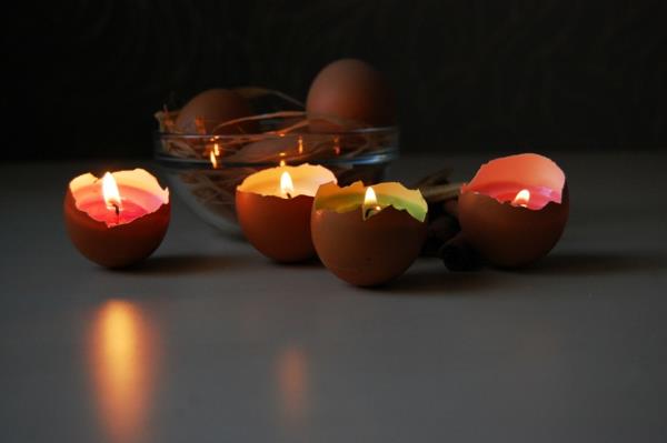 świece wielkanocne skorupki jajek kolorowy wosk palący się
