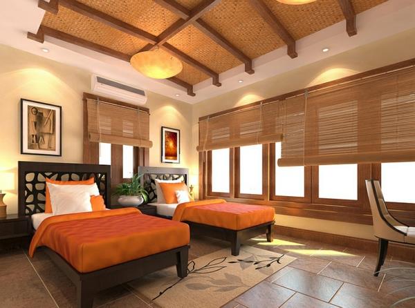 chambre à coucher mise en place des couvre-lits orange de style asiatique