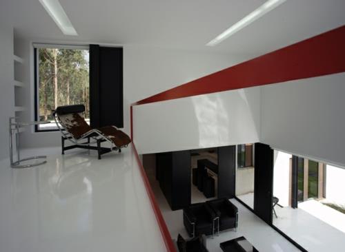 czarny biały dom umeblowanie czerwona podłoga kąt widzenia