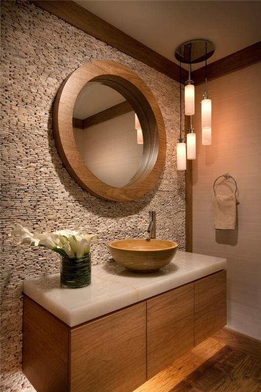 kamienna ściana łazienka projekt okrągłe ściany lustro kwiaty