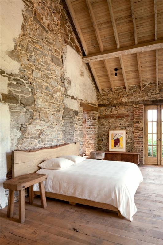 kamienna ściana projekt sypialni rustykalny wygląd drewniana podłoga