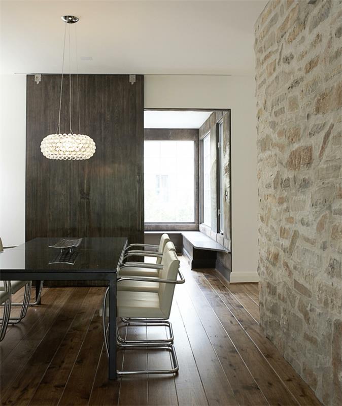 mur design salle à manger mur de pierre plancher en bois lustre moderne