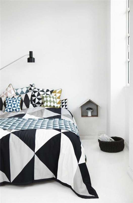 chambre à coucher blanche literie géométrique sol blanc