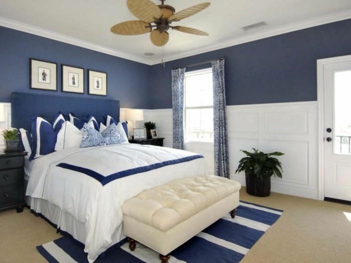 Pomysły na życie sypialnia niebieski akcent na ścianę w paski dywan rośliny zasłony