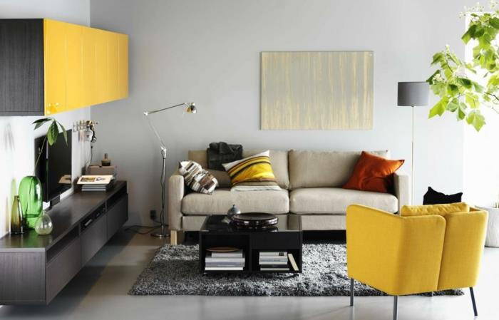 Salon fotel żółty szary dywan salon meble ścienne mały salon